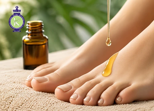 Essential oil for feet odor being applied to feet as a natural remedy for smelly feet and foot odor relief.